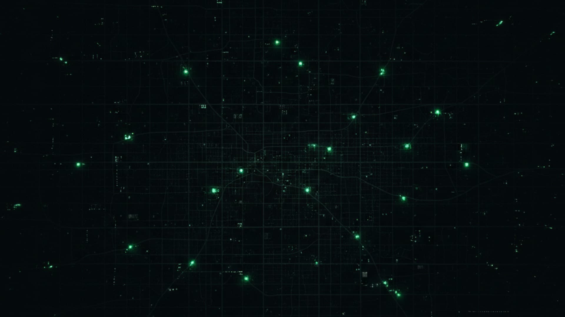 A city grid at night with scattered green points of light